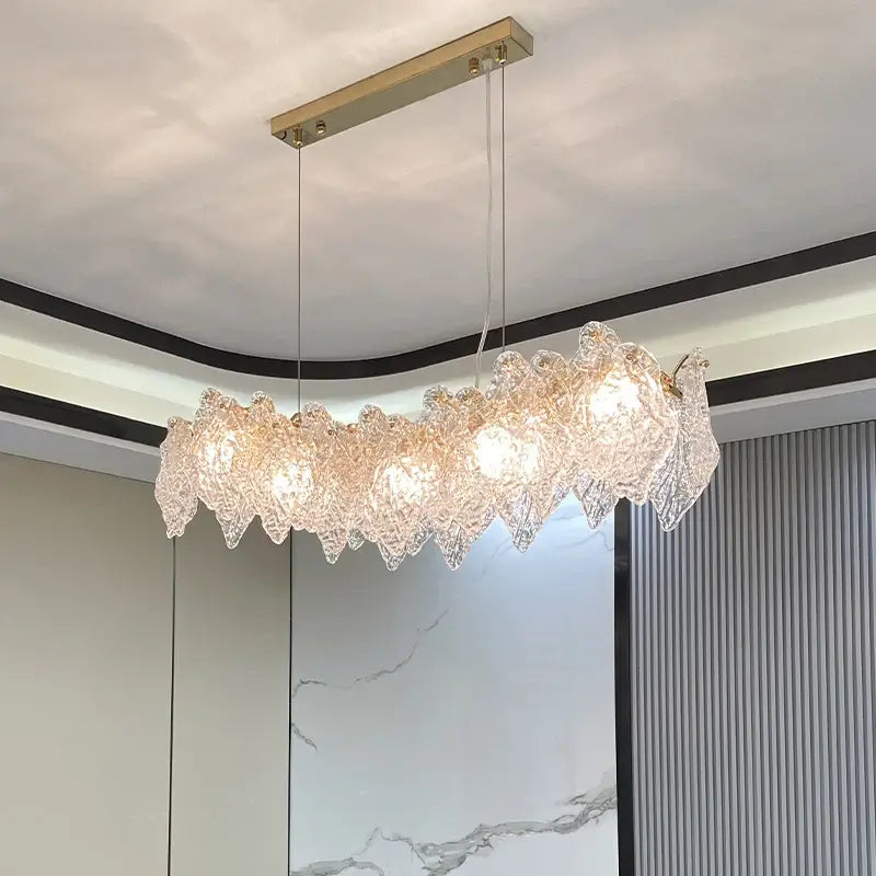 Crystal Pendant Chandelier showcasing elegant design with shimmering glass elements and energy-efficient LED bulbs.